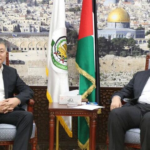 Wang Kejian (left) meets Hamas political chief Ismail Haniyeh in Qatar on Oct. 17, 2023. - Hamas via Telegram